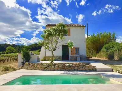 a swimming pool with two lounge chairs next to at Demeure Charmante avec Piscine privée au coeur des Vignes in Quarante