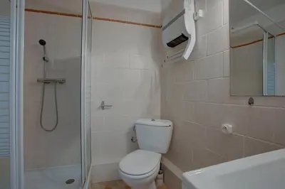 a bathroom with a toilet and a shower and a sink at L'Oustalet - Single-family home with terrace Oustalet in Ferrals-lès-Corbières