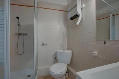 a bathroom with a toilet and a shower and a sink at L'Oustalet - Single-family home with terrace Oustalet in Ferrals-lès-Corbières