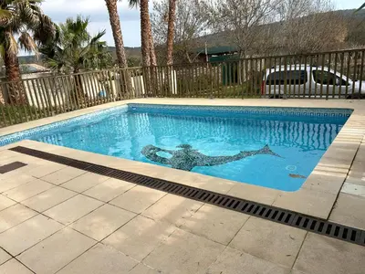 a swimming pool with a woman in the water at Vistetta in Narbonne