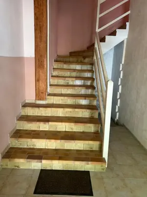 a staircase with wooden steps in a building at Vistetta in Narbonne