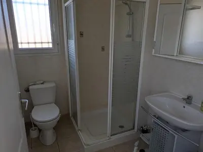 a bathroom with a shower and a toilet and a sink at Maison proche mer - 5 couchages - ideal planchistes in Lapalme