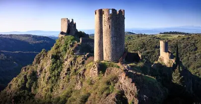 a castle sitting on top of a mountain at Maison proche mer - 5 couchages - ideal planchistes in Lapalme