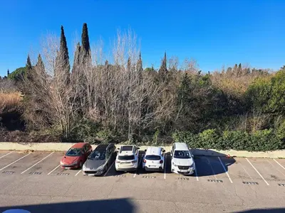 a row of cars parked in a parking lot at studio proche Narbonne centre in Narbonne