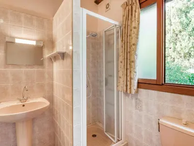 a bathroom with a shower and a sink at Sourire du Soleil in Montouliers