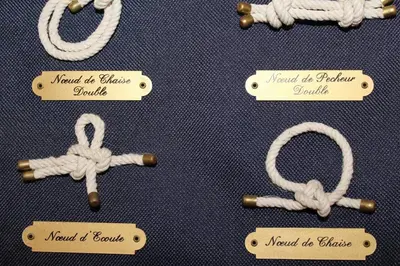 a group of knots on a table with signs at Appartement Studio Cabine - Gruissan GN110-C13 in Gruissan