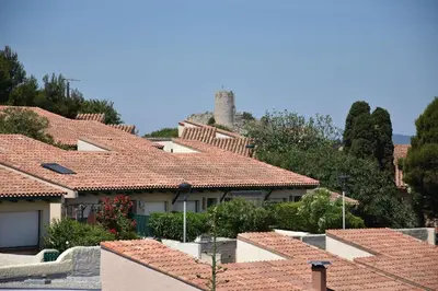a view of roofs of houses in a village at Appartement évasion sur le port de Gruissan - GN380-C67 in Gruissan