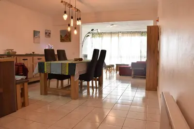 a kitchen and dining room with a table and chairs at Appartement évasion sur le port de Gruissan - GN380-C67 in Gruissan