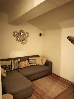 a living room with a couch and a ceiling at Cœur d 'amande in Narbonne