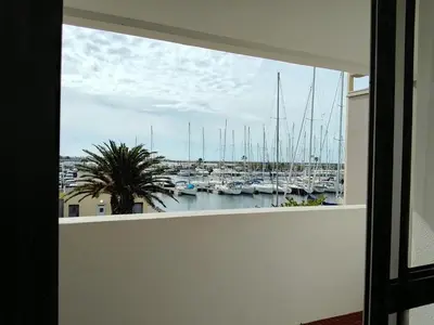 a view from a window of a marina with boats at Appartement 6 personnes Gruissan in Gruissan