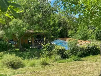 a house in the middle of a field at Maison - piscine - Vue vignobles coeur de nature in Roquetaillade