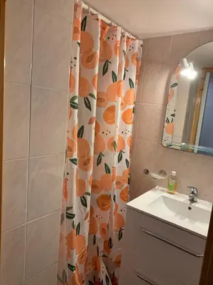a small bathroom with a toilet and a sink at L'Amandière in Cucugnan