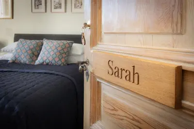 a bedroom with a door with the word spam written on it at Maison du canal du midi in Carcassonne