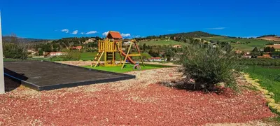 a playground with a slide in the middle of a yard at Villa d'artistes in Malras