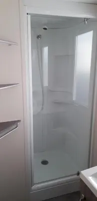 a white shower with a glass door in a bathroom at omer port la nouvelle in Port-la-Nouvelle