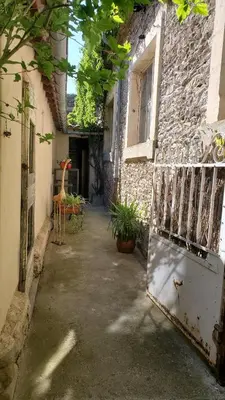 an entrance to a building with an old refrigerator at La Concha 1 in Conques-sur-Orbiel
