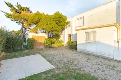 an empty driveway in front of a building at Les Jacinthes - Spacious sea view in Port-la-Nouvelle