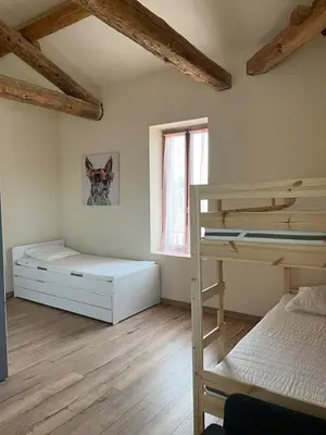 a bedroom with two bunk beds and a window at Charming Master House with Private Pool in Quarante
