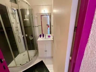 a bathroom with a shower and a sink and a mirror at Appartement T2 Confortable, 4/5 Pers, Plage Grazel, Parking Privé - FR-1-796-86 in Gruissan