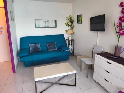 a kitchen with purple cabinets and a sink at Appartement T2 Confortable, 4/5 Pers, Plage Grazel, Parking Privé - FR-1-796-86 in Gruissan