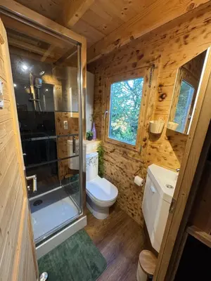 a small bathroom with a toilet and a shower at Oyana in Montgradail