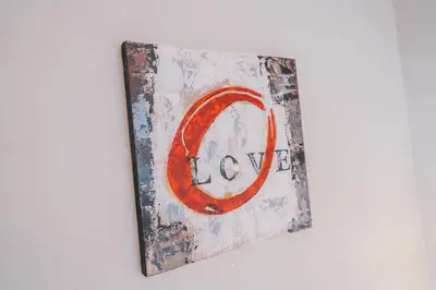a painting of a sign with the wordlow on it at Magnifique T4- toit terrasse-Cosy-Centre ville-AA in Carcassonne