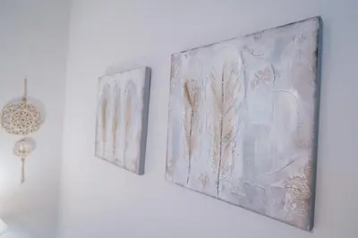 two pieces of art hanging on a wall at Magnifique T4- toit terrasse-Cosy-Centre ville-AA in Carcassonne