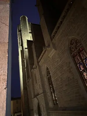 a tall tower of a church at night at Le Refuge de Saint-Vincent - T2 Hyper Centre - Proche Gare in Carcassonne