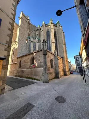 an old church with a large tower on a street at Le Refuge de Saint-Vincent - T2 Hyper Centre - Proche Gare in Carcassonne