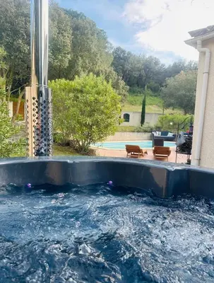 a pool with a water slide in a backyard at Carcassonne Lake & Beach, Pool villa in Carcassonne