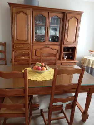 a wooden dining room table with a bowl of fruit on it at Villa Laurence in Lézignan-Corbières