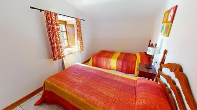 a bedroom with two beds and a window at Beau Gîte de Campagne 3 épis in Les Martys