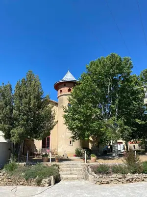 a building with a tower on top of it at Maison viticole dans le Sud de la France avec grand piscine in Moussan