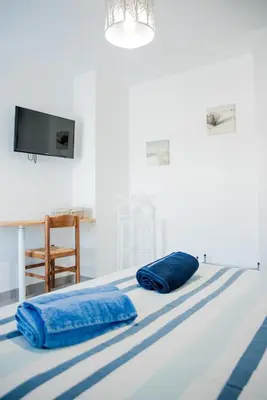 two blue pillows sitting on top of a bed at Villa Serenita in Villemoustaussou