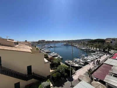 a view of a harbor with boats in the water at Appartement rénové avec vue marina Gruissan GN140-1033 in Gruissan