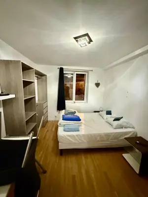 a bedroom with a large bed in a room at Maison au coeur du Sidobre in Saint-Salvy-de-la-Balme