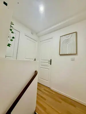 a hallway with white walls and a white door at Maison au coeur du Sidobre in Saint-Salvy-de-la-Balme