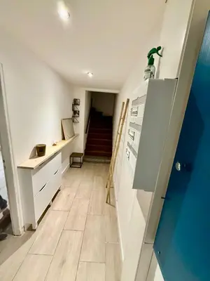 a hallway with a staircase leading to a room at Maison au coeur du Sidobre in Saint-Salvy-de-la-Balme