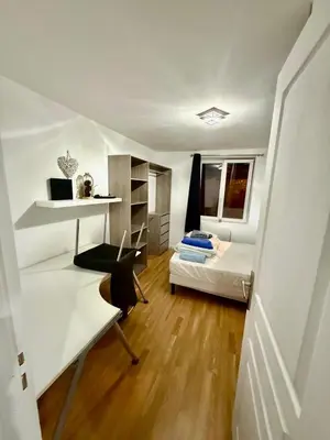 a small room with a bed and a desk at Maison au coeur du Sidobre in Saint-Salvy-de-la-Balme