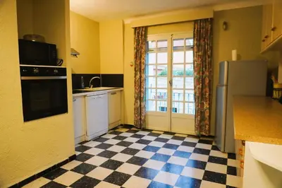 a small kitchen with a sink and a dishwasher at Lou Vidal - 6 Pers 5 minutes plage in Fitou