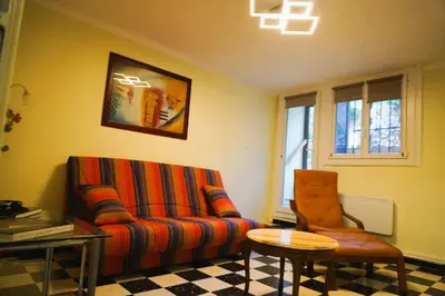 a bedroom with a bed and a wooden cabinet at Lou Vidal - 6 Pers 5 minutes plage in Fitou