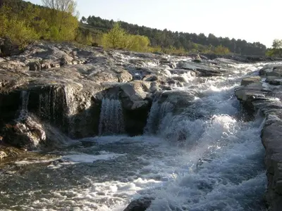 a river with rapids and waterfalls at Moliere - la maison Comfortable holiday residence in Ferrals-lès-Corbières