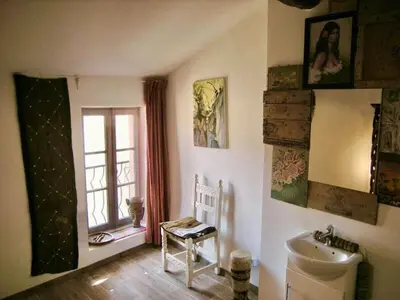 a bathroom with a sink and a toilet and a window at Moliere - la maison Comfortable holiday residence in Ferrals-lès-Corbières