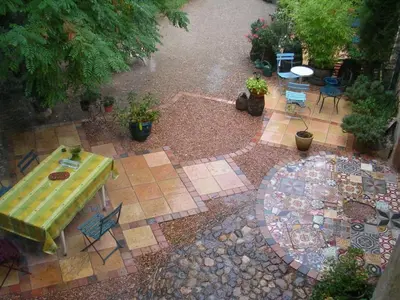 an aerial view of a patio with a table and chairs at Maison de Maitre Comfortable holiday residence in Ferrals-lès-Corbières