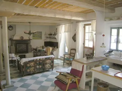 a living room with a couch and a fireplace at Maison de Maitre Comfortable holiday residence in Ferrals-lès-Corbières