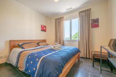 a bedroom with two beds and a window at La Belle Epoque in Escales