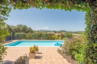 a group of lounge chairs next to a swimming pool at La Belle Epoque in Escales