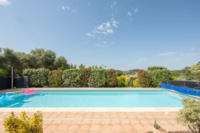 a house with a patio with chairs and plants at La Belle Epoque in Escales