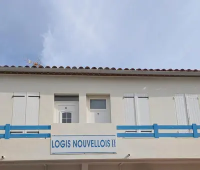 a building with a sign that reads locos novopolots ii at LE LOGIS, T2 au pied de la plage, Climatisation in Port-la-Nouvelle