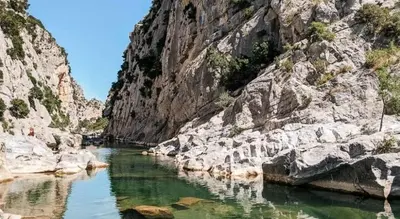 a river in a rocky canyon with green water at Détente et plaisir à Taltahull in Tautavel